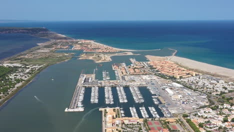 Large-aerial-shot-over-Port-Leucate-mediterranean-sea-sandy-shore-sunny-day